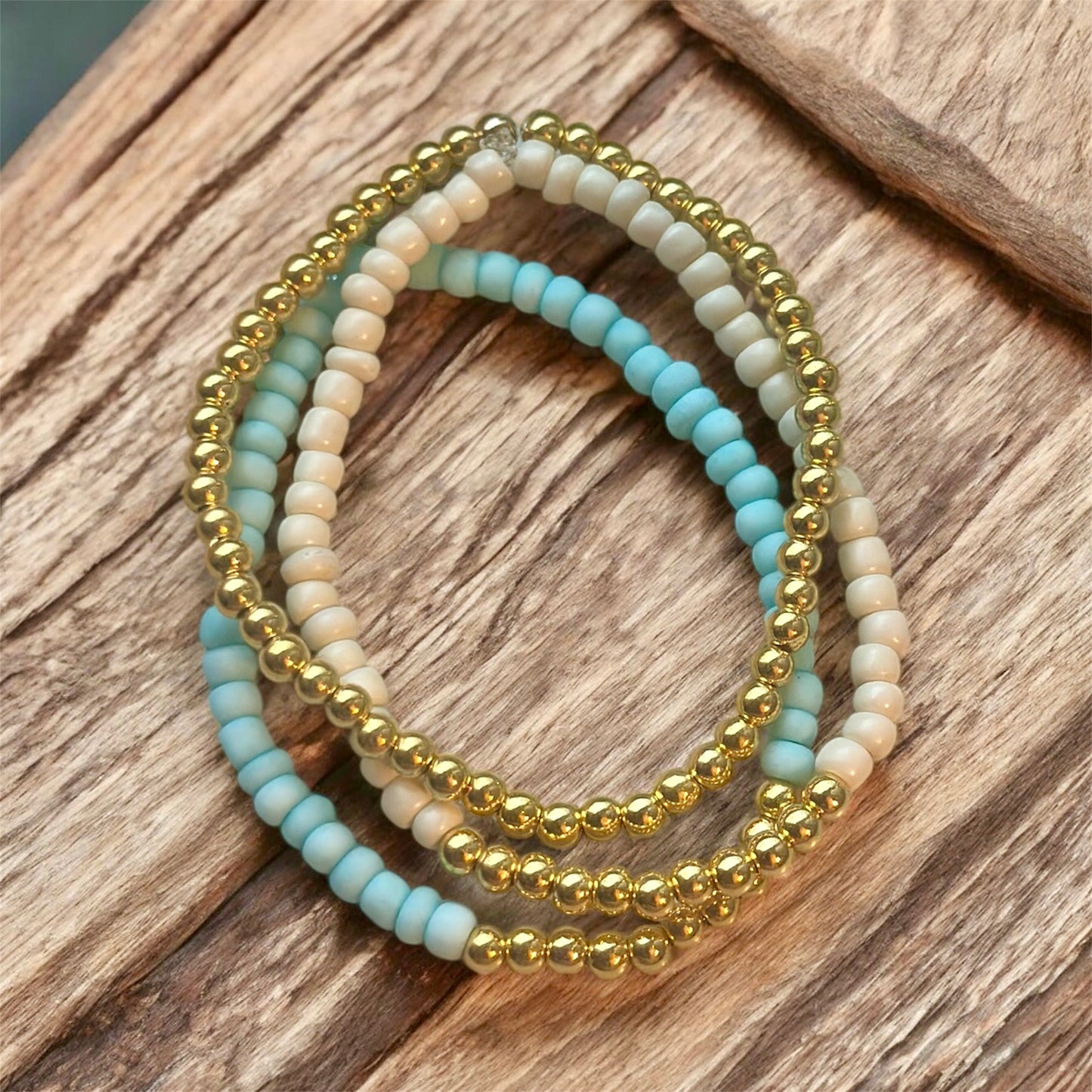 Light turquoise/cream with gold accents stackable bracelet set